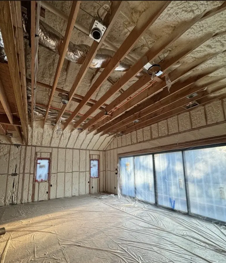 Interior walls and ceiling insulated with spray foam during new construction in Princeton